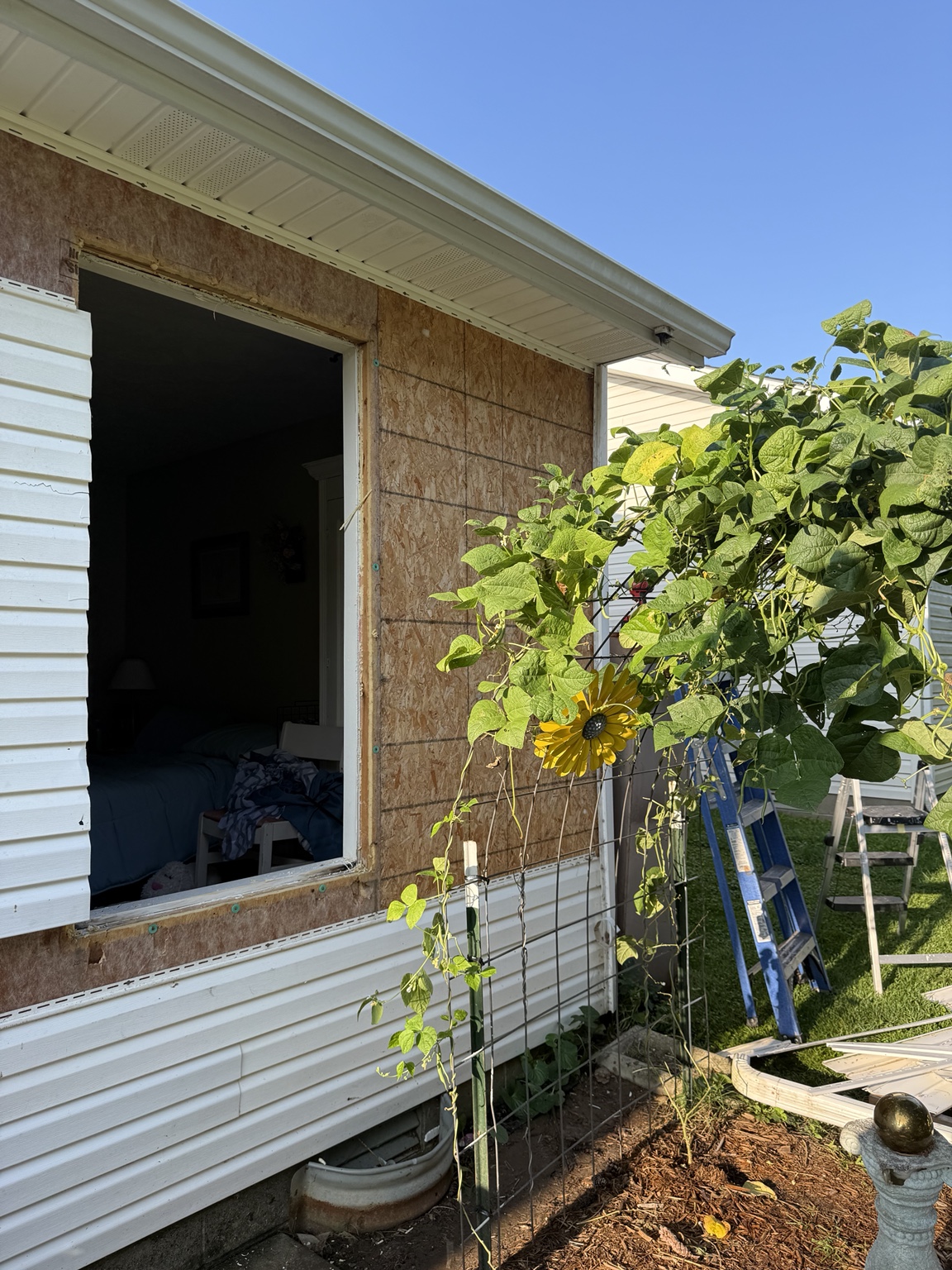 Exterior wall opened for the new door installation