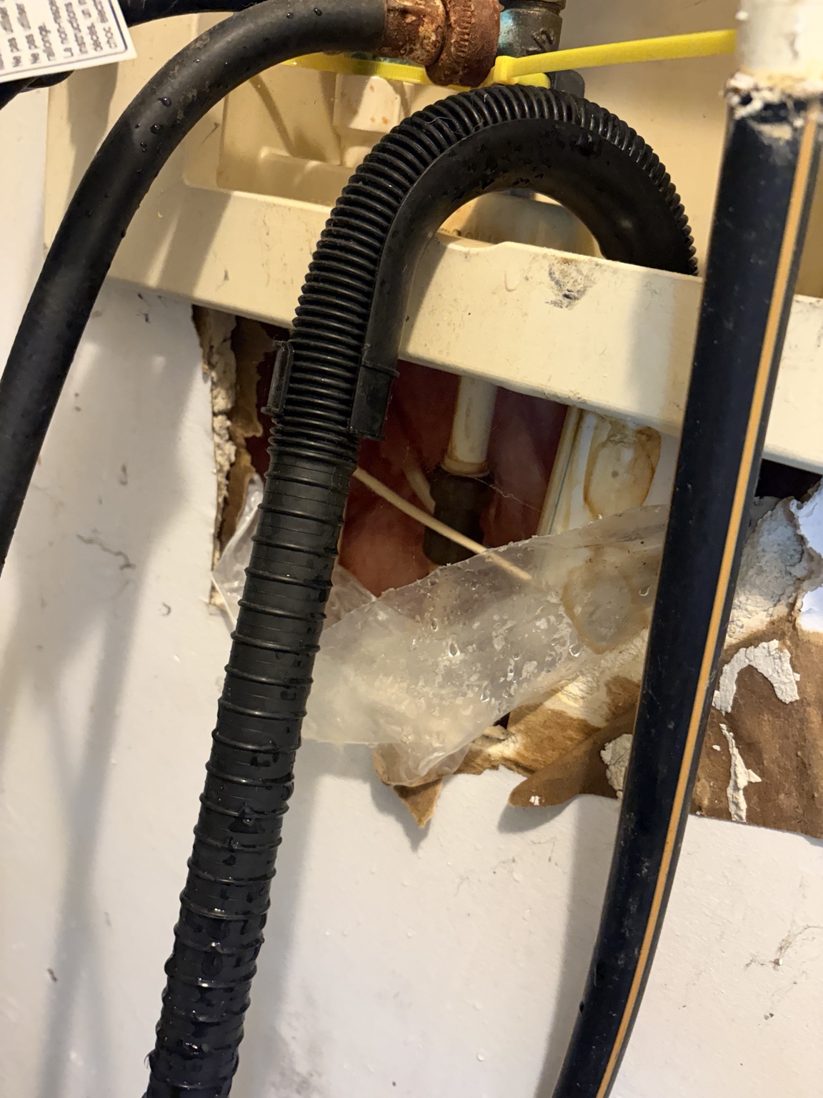 Close view of the plumbing area during leak inspection