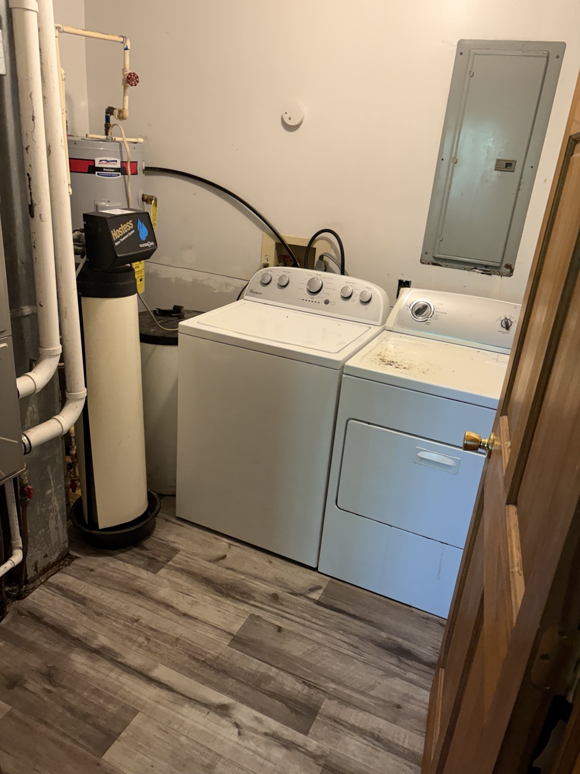 Finished laundry room with new flooring and appliances back in place