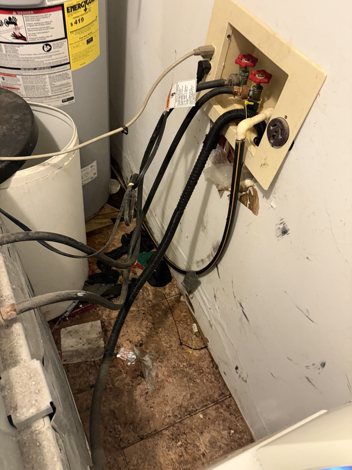 Laundry room utility area before water damage repair
