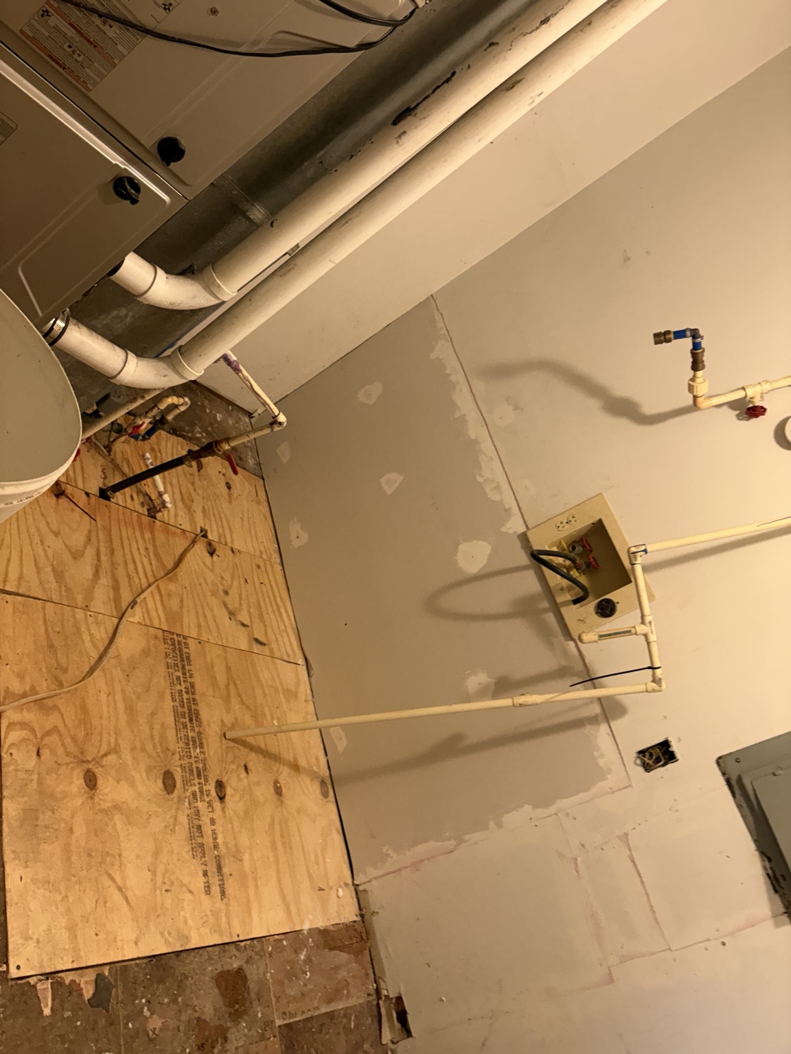 Rebuilt laundry room subfloor and repaired wall area